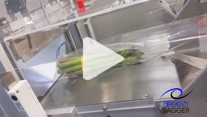 Produce being packaged with a breezy bagger bagging machine